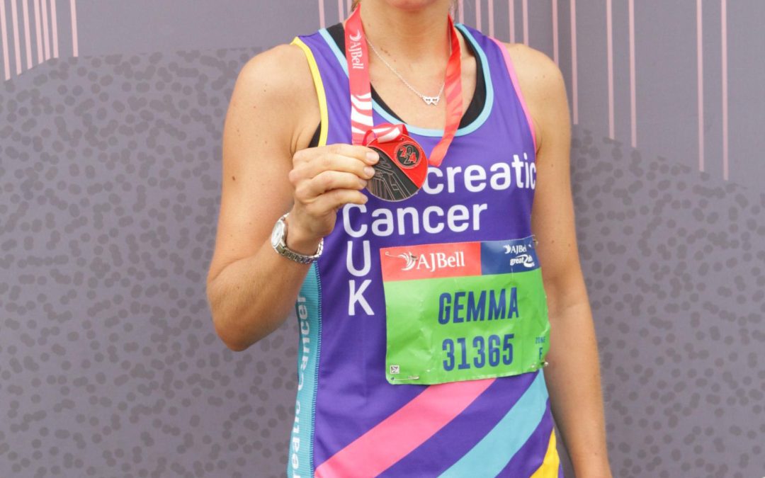 Gemma Antcliffe holding a medal for the great north run